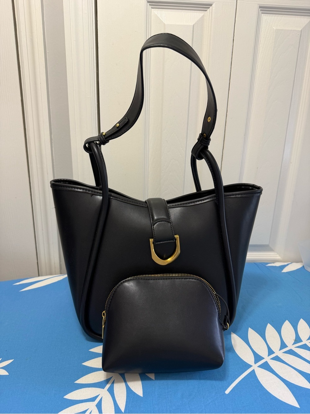 Black soft faux Leather handbag with Detachable Pouch. Like new